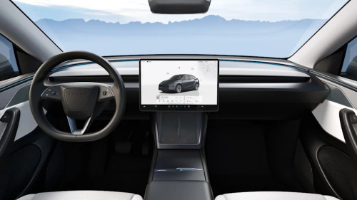 "Minimalist Tesla interior with a single central touchscreen, simplified dashboard and sleek black and white cabin layout"
