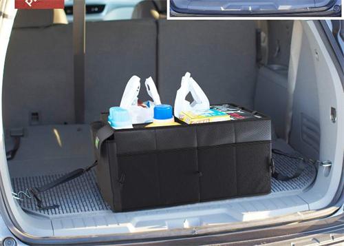 "Foldable black fabric car trunk storage organizer placed in the rear luggage compartment, used to neatly store daily groceries and sundries"