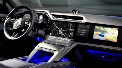 "Mazda interior with a minimalist design, equipped with a suspended small central screen, physical knob controls, brown leather seats and a traditional automatic gear shift lever"