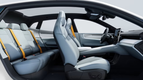  Interior of a new energy vehicle, equipped with light gray leather seats, yellow safety belts and a minimalist floating central control screen, presenting a simple and technological riding space.