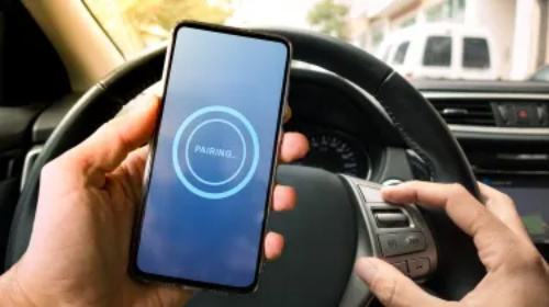 "Pairing smartphone with car multimedia system while pressing steering wheel control buttons"