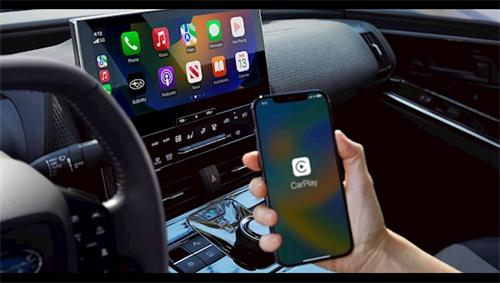 "Connecting an iPhone to a vehicle to activate Apple CarPlay on the car touchscreen display"